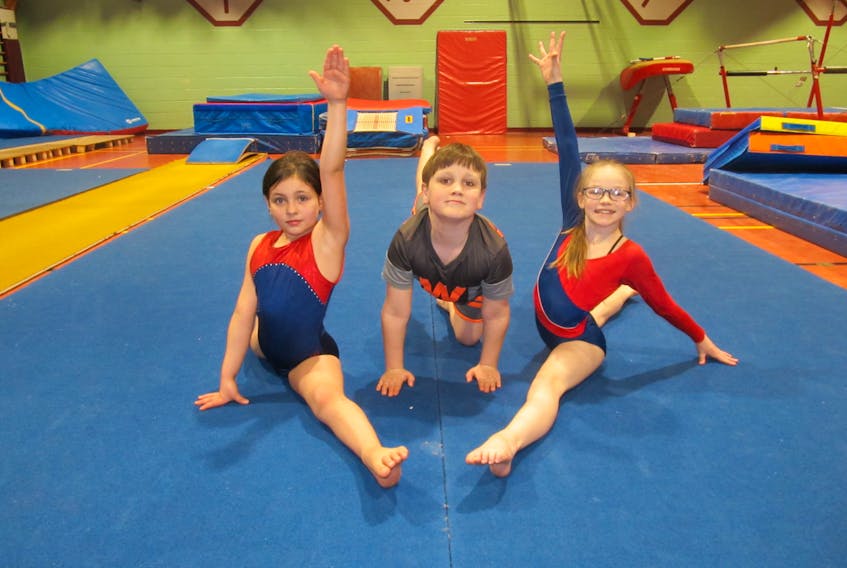 St. Louis Elementary School gymnasts, from left, Juli Wedge (pre-novice girls), Gibson Drouin (pre-novice boys) and Riley Doucette (novice girls) are all set to compete Saturday in the P.E.I. School Athletic Association’s provincial gymnastics championships. Organizers expect up to 360 students from 26 Island schools to compete at Kensington Intermediate-Senior High School gym. Paul Goguen Photo