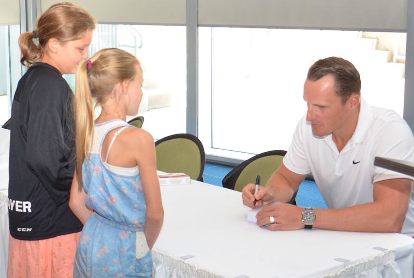 Los Angeles Kings defenceman Dion Phaneuf signs autographs for young fans following a major announcement at Credit Union Place on Wednesday. It was announced the National Hockey League Players Association (NHLPA) Goals and Dreams Fund was donating 25 sets of brand-new hockey equipment for first-time participants between the ages of 11-to 13-years-old in Summerside during the 2018-19 season. Phaneuf, who spends his summers on P.E.I., was a driving force behind this promotion.