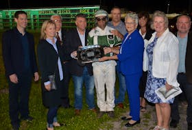 P.E.I. Lt.-Gov. Antoinette Perry and Premier Dennis King present Rose Run Quest driver Marc Campbell with the Governor’s Plate following a 1:53 win at Red Shores at Summerside Raceway late Saturday night. The Governor’s Plate, presented by Township Chevrolet Buick GMC and Noonan Petroleum, featured a $25,000 purse. Also taking part in the presentation were, from left: Adam Toner of Township Chevrolet Buick GMC; Judy Hansen, wife of owner Blair Hansen; Summerside Mayor Basil Stewart; owner Blair Hansen; King’s wife Jana, and Finance Minister Darlene Compton, who is also the minister responsible for harness racing, and her husband Russ.
