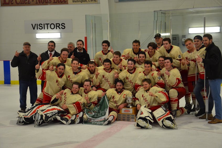 The Western Red Wings pose for a team photo after winning their third straight Island Junior Hockey League championship on Sunday afternoon. The Red Wings defeated the Kensington Vipers 8-4 to win the best-of-seven final 4-1.