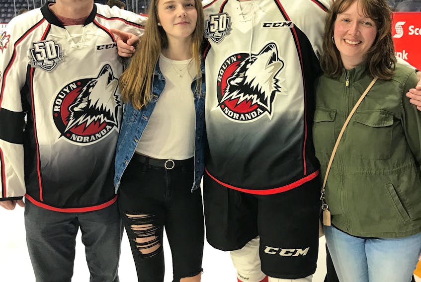 Rouyn-Noranda Huskies defenceman Noah Dobson celebrates winning the President Cup and Quebec Major Junior Hockey League’s playoff most valuable player award with his parents, Andrew and Jenny, and sister, Elly. The Huskies defeated the Halifax Mooseheads 4-0 to win the best-of-seven series in six games.