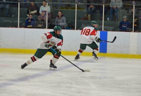 Kensington Wild forward Jack Campbell carries the puck into the offensive zone while linemate Reid Peardon stays onside in a New Brunswick/P.E.I. Major Midget Hockey League game during the 2018-19 season.