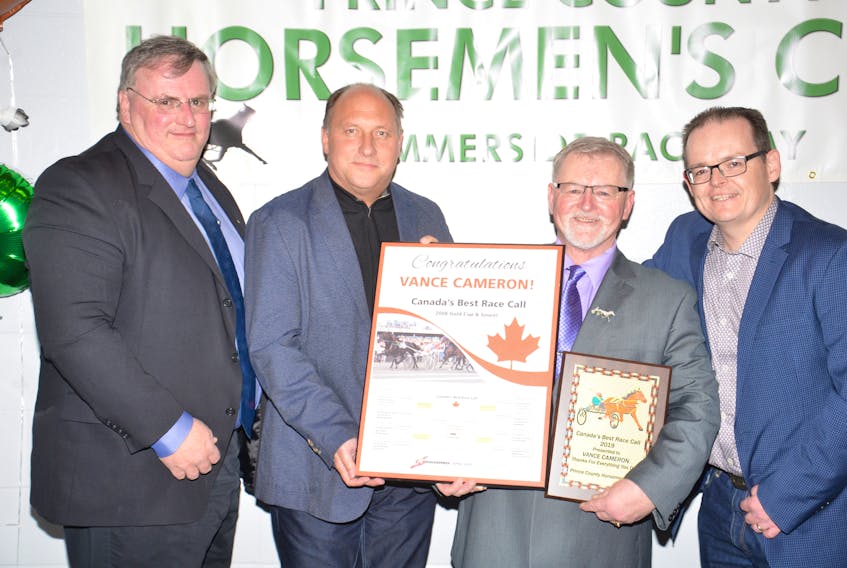 Vance Cameron, second right, of Summerside was recognized for winning Standardbred Canada’s Canada’s Best Race Call at the recent Prince County Horsemen’s Club awards dinner in Summerside. Congratulating Cameron, from left, are Kent Oakes of Standardbred Canada, Lee Drake of Red Shores and Peter MacPhee, a member of the Red Shores’ broadcast team.