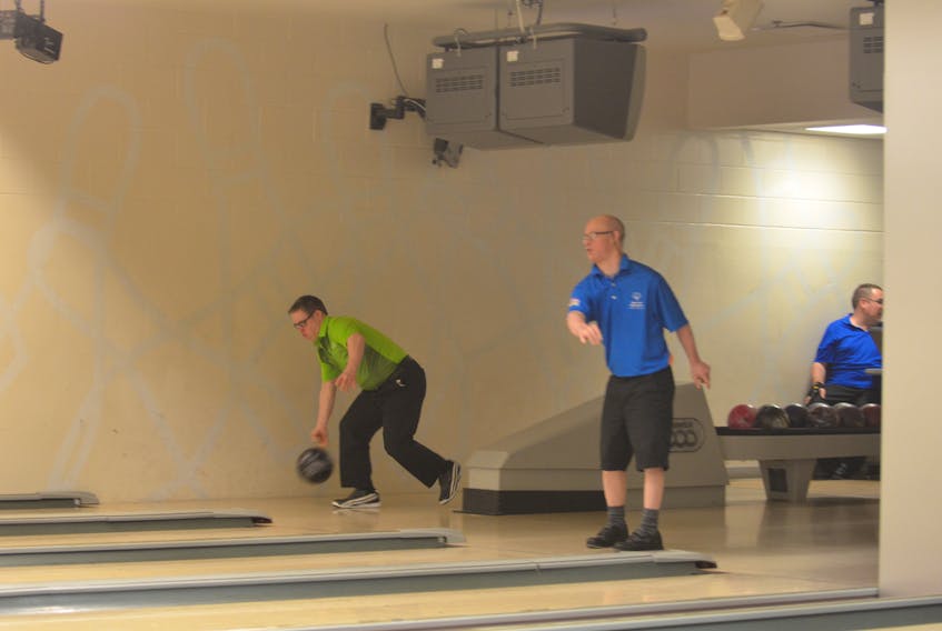 Team P.E.I.’s Paul Phillips, green jersey, of Summerside releases the ball during the team competition of the Special Olympics Canada 2018 bowling championships at Credit Union Place on Tuesday. Team P.E.I. won a bronze medal.