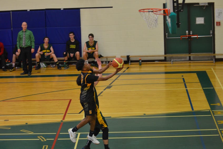 The Dartmouth High Spartans’ Kyrie Thompson drives to the basket for a lay-up during first-half action in the championship game of the 24th edition of the Three Oaks Senior High School Christmas Classic in Summerside on Saturday afternoon.