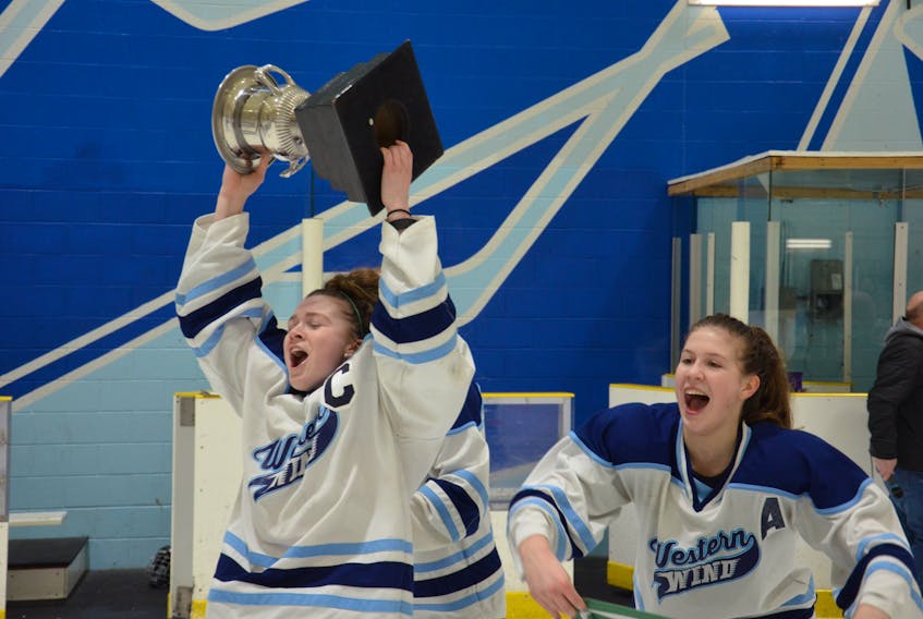 The emotion is etched in the face of Gracyn Handrahan as she hoists the Dalziel Cup after captaining the Western Wind to the 2018-19 P.E.I. Midget AAA Female Hockey League playoff championship at Credit Union Place’s Ice Pad on March 12. Also celebrating with Handrahan is assistant captain Paige Deighan. It marked the first provincial championship for Handrahan, who has been playing hockey since she was four.