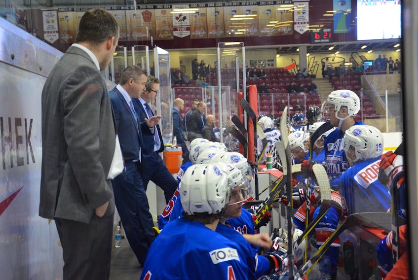 Summerside Western Capitals head coach Billy McGuigan, centre, talks to his players during a timeout of a game at Eastlink Arena during the 2017-18 MHL (Maritime Junior Hockey League) regular season.