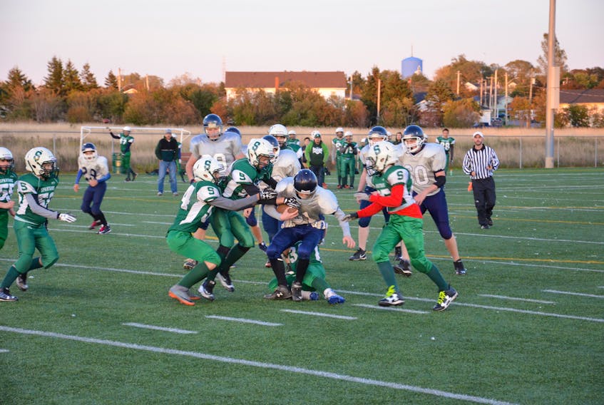 The Summerside Waterwise Spartans, green uniforms, defeated the Charlottetown Privateers 24-6 in a Papa John’s P.E.I. Bantam Tackle Football League game at Eric Johnston Field on Oct. 13.