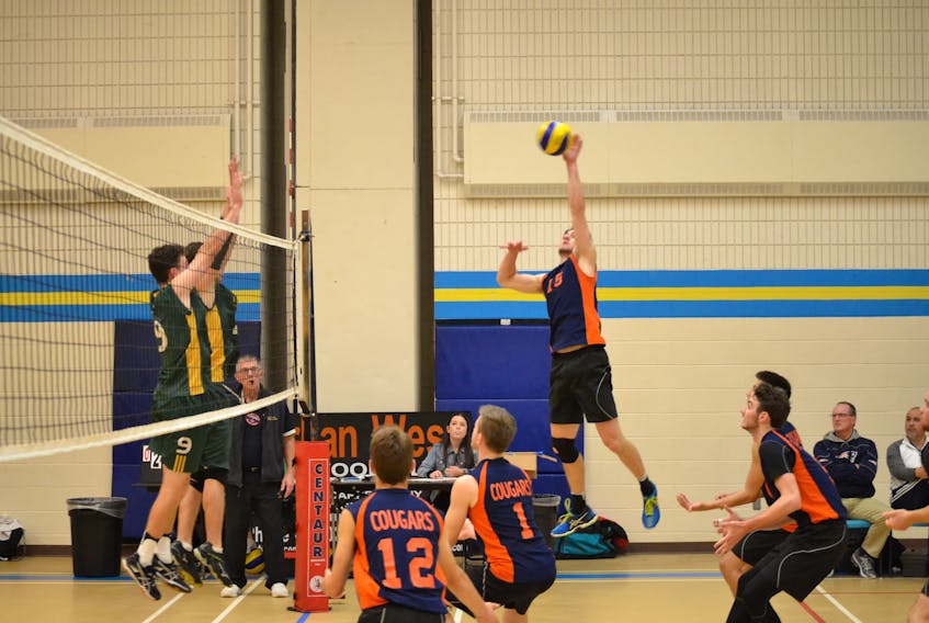 Tournament all-star Thomas Vickers of the Cobequid Education Centre Cougars soars high to smash the ball during the boys’ championship match of the 35th annual Westisle Wolverine Volleyball Classic against the Three Oaks Axemen on Saturday evening. The Cougars prevailed two sets to one.
