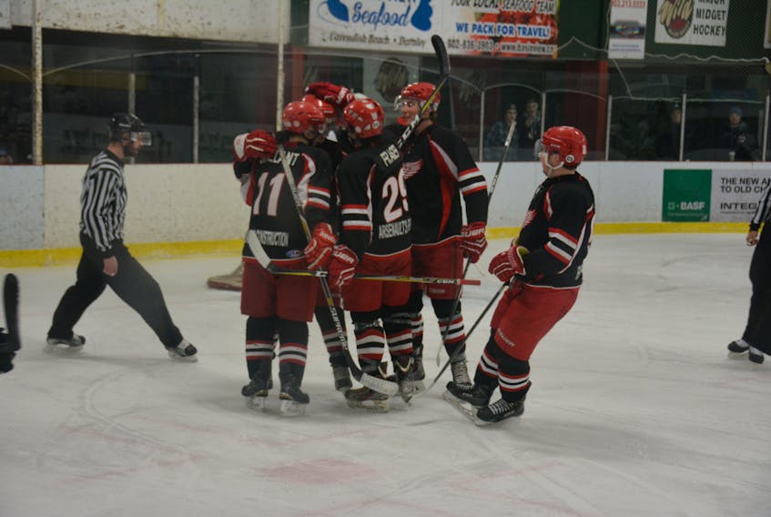 The Arsenault’s Fish Mart Western Red Wings celebrate scoring a goal during an Island Junior Hockey League regular-season game against the Kensington Moase Plumbing and Heating Vipers in Kensington on Dec. 10.