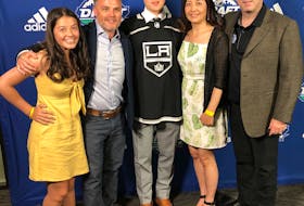 Jordan Spence, centre, receives congratulations after the Cornwall, P.E.I., resident was selected in the fourth round, 95th overall, by the Los Angeles Kings in the National Hockey League Entry Draft on Saturday afternoon. From left: Spence’s sister, Kairi, 14; his parents Adam and Kyoko, and Summerside Western Capitals head coach Bill McGuigan. Spence credited his one season in the MHL (Maritime Junior Hockey League) with the Caps under McGuigan as a turning point in his career.