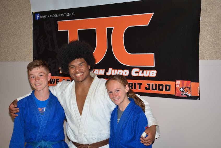 Three members of the Summerside Toshidokan Judo Club won medals at the recent Canadian open judo championships in Edmonton. They are, from left: Mikey Perry, bronze in under-16 -50 kilograms; George Madumba, silver in under-18 -90 kilograms, and Shayna Perry, silver in under-16 -42 kilograms.