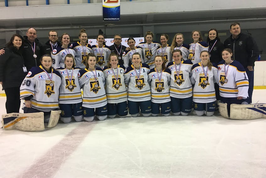 The Mid-Isle Wildcats pose for a team photo after winning the bronze medal at the 2018 Atlantic midget AAA female hockey championship in Mount Pearl, N.L., on Sunday morning. The Wildcats defeated the Western Warriors from Newfoundland and Labrador 3-0 in the third-place game. Members of the Wildcats are, front row, from left: Hannah LeClair, Maggie Linkletter, Tait Tierney, Makayla Larsen, Kennedy Francis, Cassie Doiron, Madeline Hamill, Jennifer Stewart and Emma Arsenault. Back row: Maureen Mix (manager), Shane Hamill (assistant coach), Andrew MacEwen (assistant coach), Jacqueline Mix, Carla Stewart, Carly Thompson, Kevin Andrews (head coach), Keiran Andrews, Lexie Murphy, Sophie Flynn, Kelsey Weeks, Charlotte Linkletter, Ellen Chapman (assistant coach) and Blair Stewart (trainer).