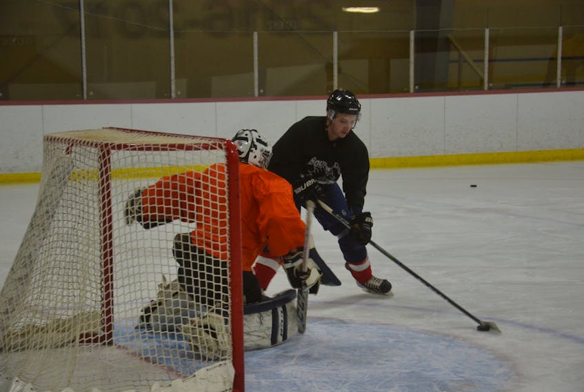 Southside Lynx defenceman Jarrett Mulligan takes a close-in shot on goaltender Sean MacPhee during a team practice at the South Shore Actiplex on Sunday evening. The Lynx is hosting the Maritime Hockey North junior C championship from Wednesday to Sunday.