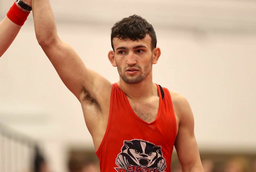 Ligrit Sadiku of Summerside has his arm raised in victory at the U Sports national wrestling championships in Calgary recently.