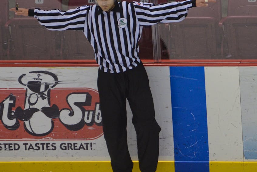 Tanner Doiron of Summerside makes a call at the blue-line during a Summerside Western Capitals’ junior A game at Eastlink Arena last season. Doiron will begin working as a linesman in the Quebec Major Junior Hockey League next season.