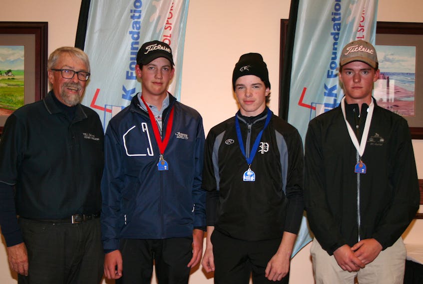 Two Kensington Intermediate-Senior High School students won the gold and silver medals at the P.E.I. School Athletic Association (PEISAA) provincial senior A golf championship at Brudenell River Golf Club recently. PEISAA golf commissioner congratulates gold-medal winner Campbell Mayne, second left, and silver-medallist Landon Clow, centre. Montague’s TJ MacLeod, right, earned the bronze medal. Submitted photo