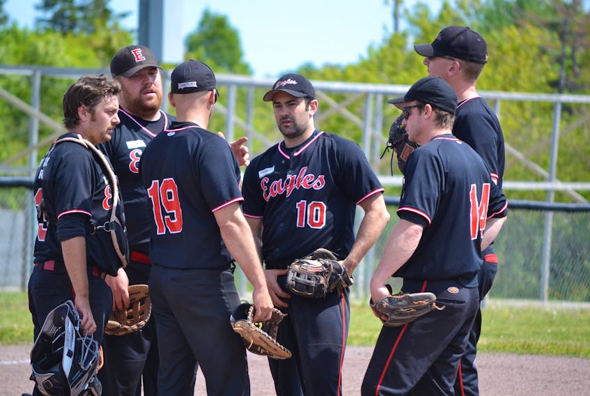 The O’Leary Summerside Chrysler Dodge Eagles infield of catcher Morgan Murphy; third baseman Jason Smallman, first baseman Jeff Ellsworth, 19; shortstop Jesse MacIntyre, 10; second baseman Mike MacIsaac, 14, and pitcher Steve Noonan, far right, hold a conference during their championship game against the Nova Scotia under-23 team. The Eagles dropped a 4-2 decision.