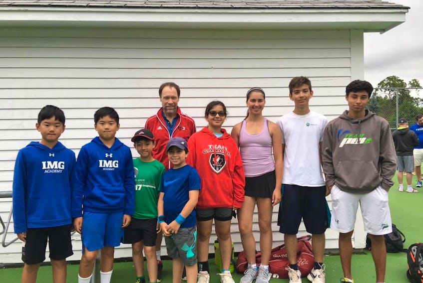 P.E.I. competitors taking part in the Atlantic outdoor junior tennis championships in Fredericton, N.B., this week are, front row, from left: William Wang, Charlie Wang, Sebastian Nguyen, Elijah Opps, Maria Campeanu, Rachel Phalen, Cezar Campeanu and Enrique Riveroll. Coach Brian Hall is in back.