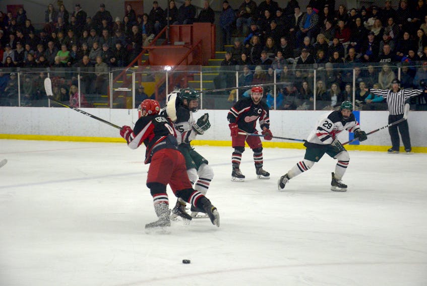 Kensington Vipers’ affiliated forward Dixon MacLeod looks to get around Western Red Wings’ veteran defenceman Spencer Groom during Game 4 of the Island Junior Hockey League final series in Kensington. The Red Wings and Vipers will open the 2019 Don Johnson Memorial Cup Atlantic junior B hockey championship tournament at Credit Union Centre on Tuesday at 7 p.m.