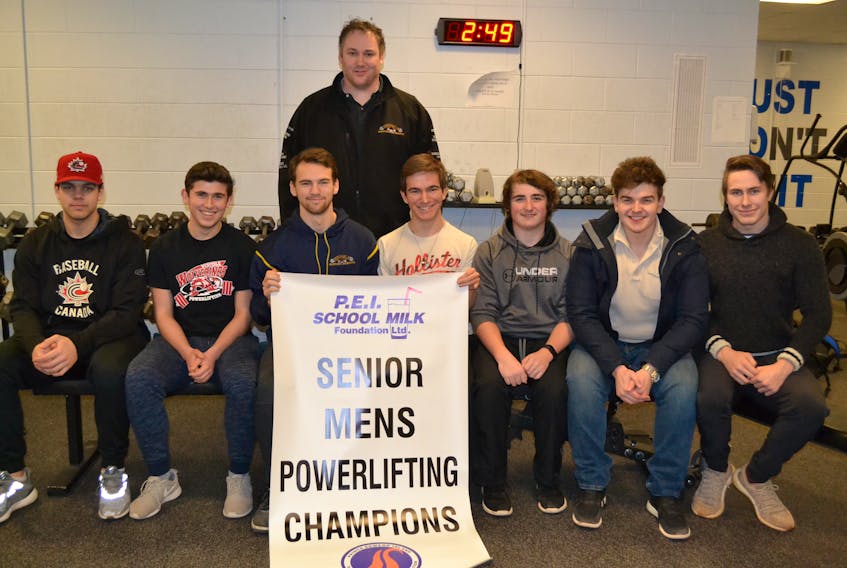 Members of Westisle Composite High School’s P.E.I. School Athletic Association provincial-champion senior boys’ powerlifting team pose for a team photo. Seated, from left: Jacob Gallant, Cameron Arsenault, Chandler Gard, Brendon Harper, Dawson Richard, Nigel Perry and Marcus Ferguson. Coach George Kinch is standing. Missing from photo is Chandler Wood.
