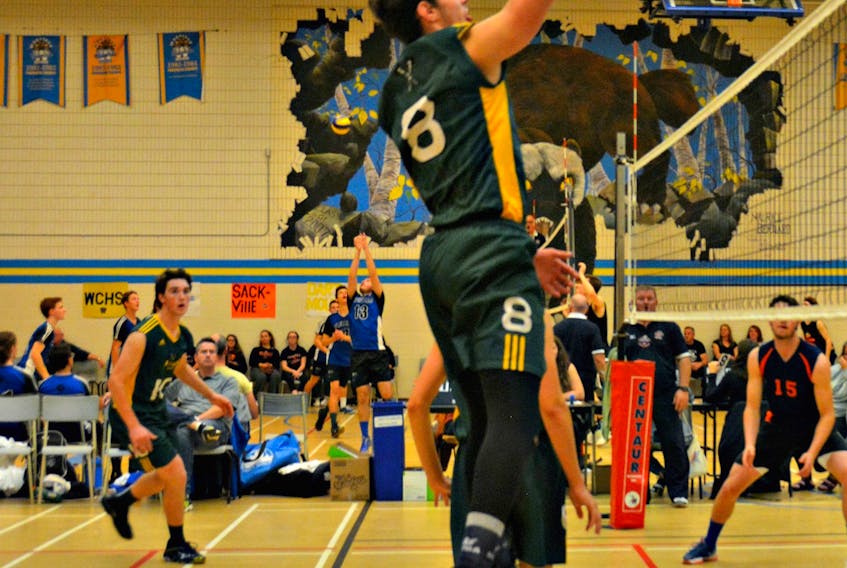 The Three Oaks Axemen’s Cameron Wall, 8, jumps in the air to hit the ball during the gold-medal game of the 34th annual Wolverine Volleyball Classic at Westisle Composite High School on Saturday afternoon. The Cobequid Education Centre Cougars from Truro, N.S., defeated the Axemen 2-0 (25-18, 25-22).