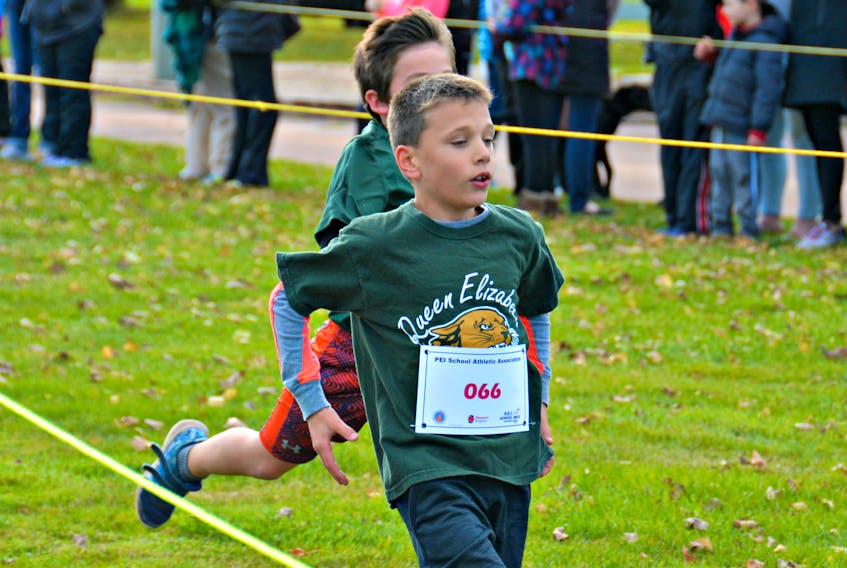 Connor Clark, 8, gains speed as he nears the finish line at the P.E.I. School Athletic Association (PEISAA) cross-country championships at Mill River on Saturday. “It gets him outside, instead of watching computer games. It’s good for them,” commented his grandmother, Joan Clark.