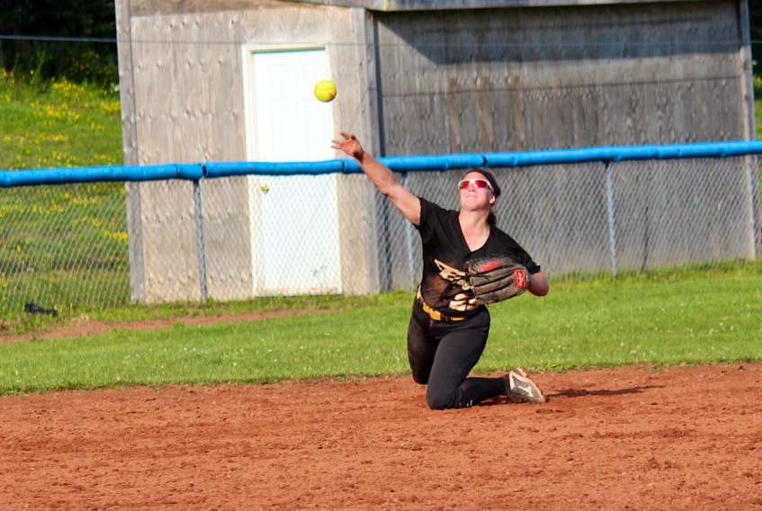 The P.E.I. Eagles’ Kaelyn White makes a throw to first base from her knees after making a diving stop during play in the Lloyd Poirier Memorial women’s fastpitch tournament in Truro, N.S., recently. The Eagles earned the silver medal.