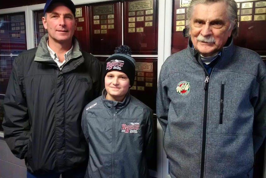 Kale Hunter, centre, will follow in the footsteps of his father, Kevin Hunter, left, and grandfather Bob Bowness when he participates in the 50th Kensington, P.E.I.-Bedford, Que., Peewee Friendship Hockey Exchange this weekend. Hunter is a goaltender with this year’s Kensington team. Kevin, who also played goal, participated in the 1981 exchange and Bowness coached Kensington teams in the exchange six different times.