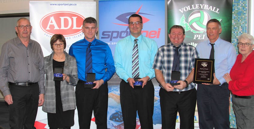 The 1989 Westisle Wolverines’ senior boys’ volleyball team was inducted into the Volleyball P.E.I. Hall of Fame recently. Volleyball P.E.I. president Brenda Millar, right, congratulates team members in attendance. From left: Lorne and Linda O’Halloran, representing their son, the late Roger O’Halloran, John Ellsworth, Lorne MacKendrick, Glenn Ford and coach Peter Bolo.