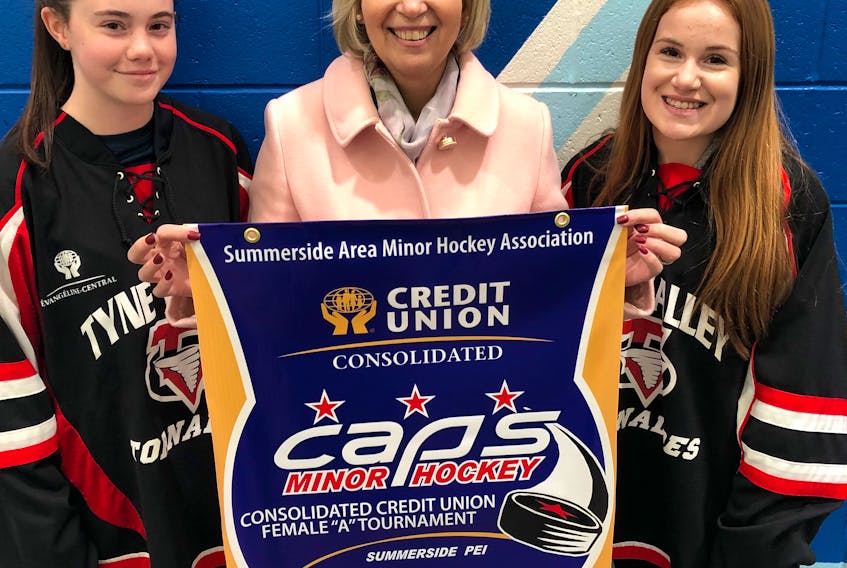 Four teams will compete for top honours in the Consolidated Credit Union (CCU) bantam A female hockey tournament at Credit Union Place this weekend. Play begins late Friday afternoon and wraps up with the championship game on Sunday at 1:50 p.m. Madison Chaisson, left, and Charlotte Murray of Summerside and members of the Tyne Valley Tornadoes are joined by Sarah Millar of the tournament’s title sponsor.