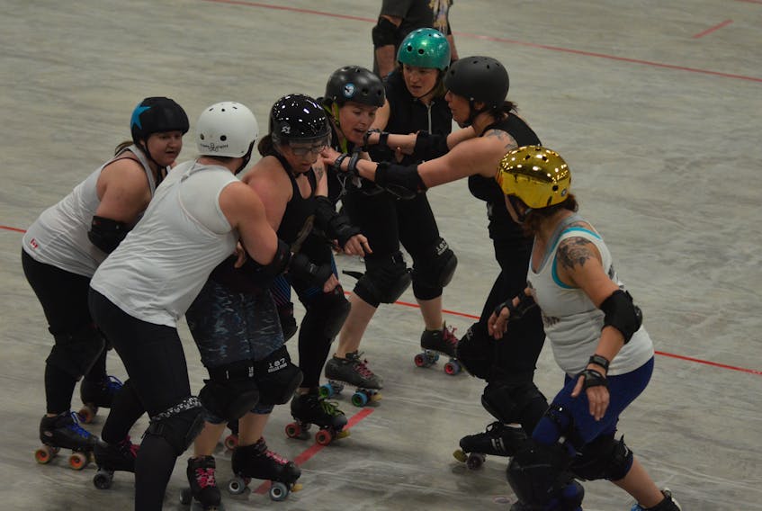 The Twisted Sisters work on a drill during a team practice Wednesday night. The Twisted Sisters will host their season-opening bout at The Plex in Slemon Park on Saturday at 7 p.m.