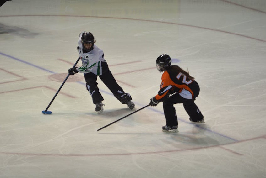The 2018 Atlantic ringette championships, featuring 22 teams and more than 330 athletes, got underway at Credit Union Place in Summerside on Friday. A total of 18 games were scheduled on opening day. Autumn Chandler, 43, of the P.E.I. Wave under-16 squad looks to protect the ring from Southeast Fusion defender Annabelle LeBlanc. The Wave pulled out a 4-1 victory.