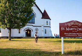 A piper welcomes guests to historic St. Mary’s Church, the venue for the Indian River Festival.