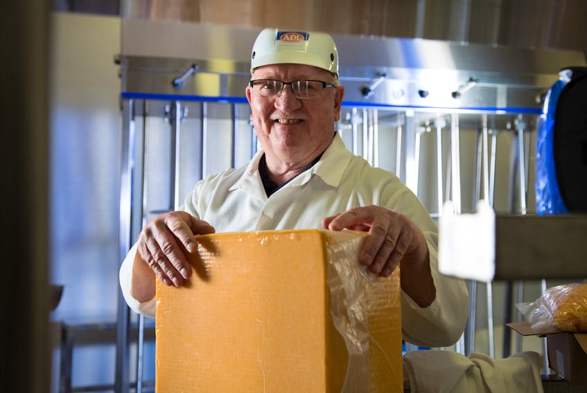 Darcy Carr, Dairy Isle master cheese maker for ADL, is all smiles after Dairy Isle captured three first-place finishes at the British Empire Cheese Show in Ontario.