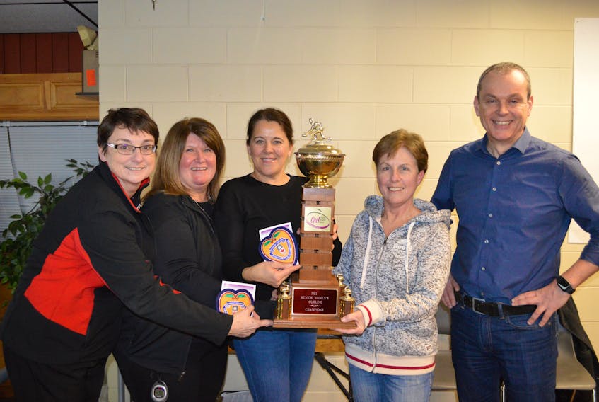 The Kim Aylward rink of the Silver Fox Entertainment Complex in Summerside won the P.E.I. senior women’s curling championship on Monday. Aylward edged the Shelley Ebbett entry from the Cornwall Curling Club 6-5 in the final. Members of the winning rink, from left, lead Donna Whelan, second stone Debbie Caissy, third stone Shelley MacFadyen and Aylward receive congratulations from Curl P.E.I. past president Andrew Robinson.