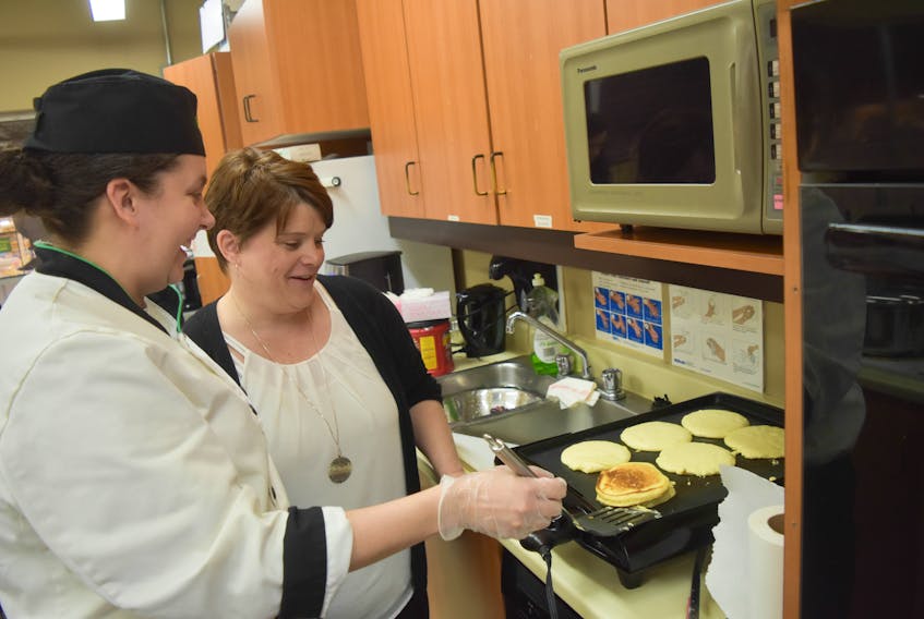 Courtney MacDonald, a red seal chef at Sobeys, helped cook up some pancakes for a Pictou County Helpers Fundraiser on Saturday, April 20. Assisting her was Cindy Ross-Miller, fundraising director for Pictou County Helpers.