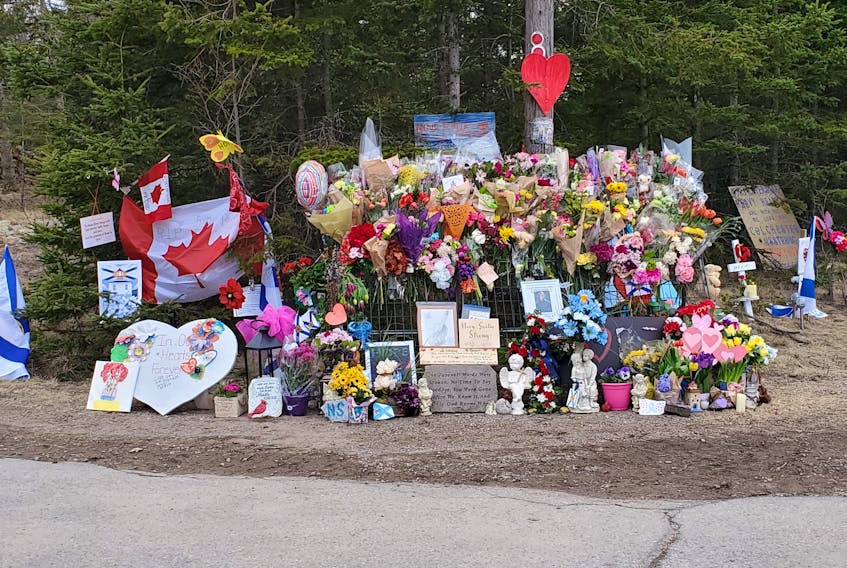 A roadside shrine in Portapi to victims of last week's shooting victims continues to grow.