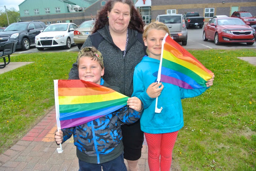 Emma Brown of Cumberland Pride is joined by her son, Max, and daughter, Sarah, in showing off the Pride flags in preparation for numerous Pride Week events across Cumberland County that begin Monday, June 10.