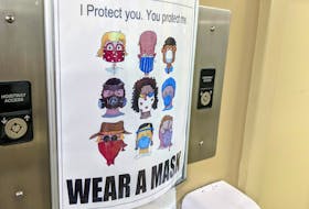 A poster in a Halifax building promotes the use of masks to prevent the spread of COVID-19. - File