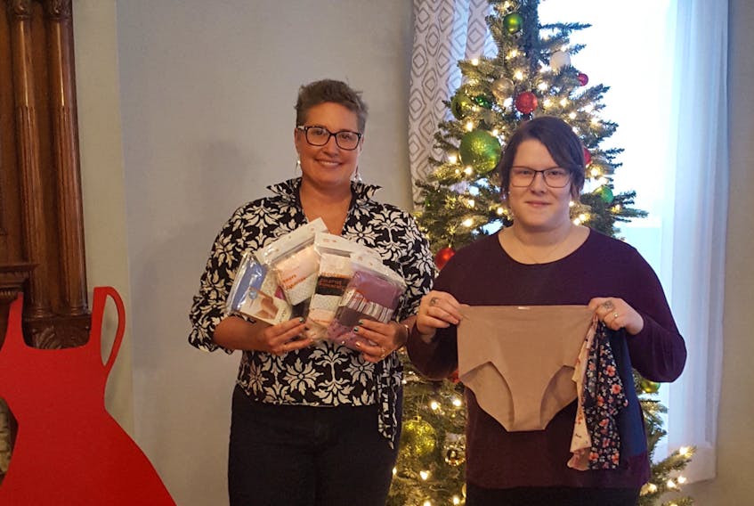 Julie Crouse, from the NSCC, left, and Lotus Centre administrative assistant Sandi Dunbar display some of the underwear donated to the centre. The items will be distributed to women in need.