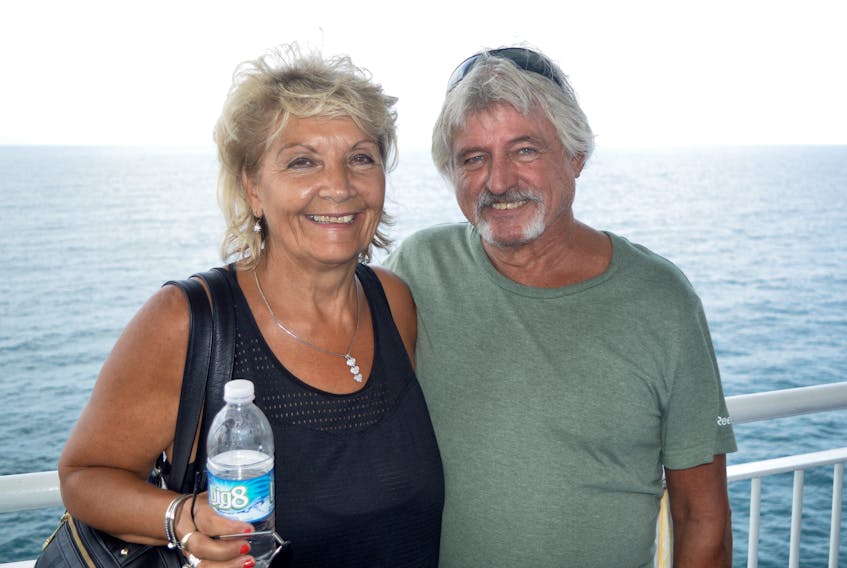Tina Huszar, left, and husband Brian Store stand on the MV Highlanders deck during an Aug. 7 crossing between North Sydney and Port aux Basques, N.L. The couple were traveling to Newfoundland on vacation to visit Huszar's step father and sister.