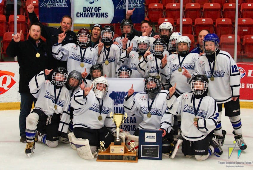 The Cumberland County Amherst Toyota Ramblers celebrate after winning the Nova Scotia peewee AA championship on April 7 in Truro. -Team Impact Sports Fotos photo
