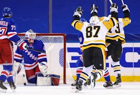 Pittsburgh Penguins captain Sidney Crosby celebrates his game-winning goal against Alexandar Georgiev of the New York Rangers at 2:27 of overtime Saturday at Madison Square Garden. The Penguins defeated the Rangers 5-4. - Bruce Bennett / USA Today Sports
