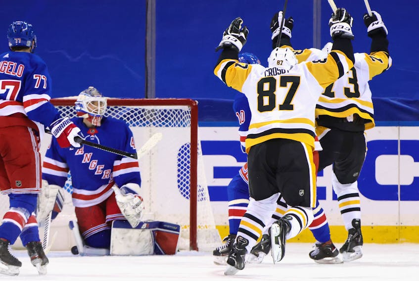 Pittsburgh Penguins captain Sidney Crosby celebrates his game-winning goal against Alexandar Georgiev of the New York Rangers at 2:27 of overtime Saturday at Madison Square Garden. The Penguins defeated the Rangers 5-4. - Bruce Bennett / USA Today Sports