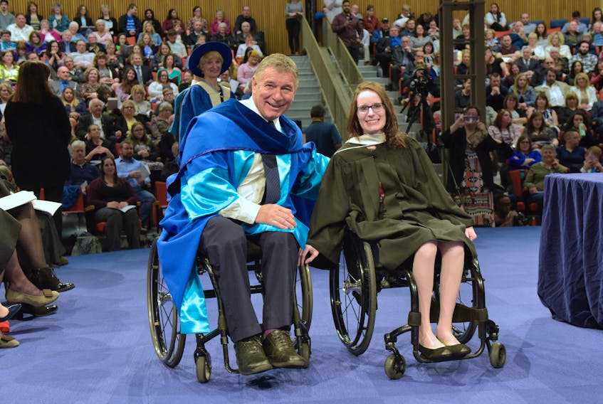 Honorary degree recipient Rick Hansen talks with Oxford native and Mount St. Vincent University valedictorian Casey Perrin following graduation ceremonies at the Halifax university on May 17.