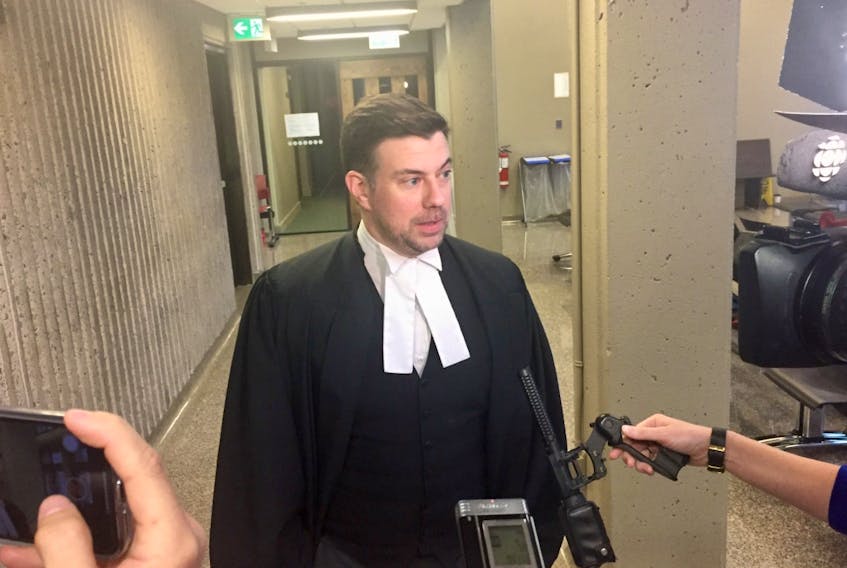 Defence lawyer Peter Planetta speaks with reporters Thursday after making closing arguments at Matthew Albert Percy's trial in Nova Scotia Supreme Court on a charge of sexual assault causing bodily harm.