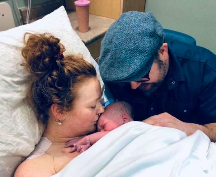 Meaghan Blanchard and her husband, Thomas Webb, share a special moment with Casey James Webb. P.E.I.’s New Year’s baby was born at 4:13 a.m. on Jan. 1 at the Prince County Hospital in Summerside. The couple lives in O’Leary, P.E.I. - Meaghan Blanchard/Special to the Guardian