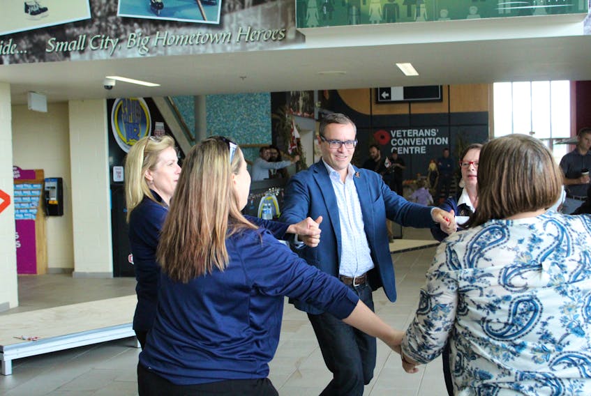 Evan Johnston, chairman of the bid evaluation committee, gets in on a dance while being welcomed to Credit Union Place, Wednesday. Johnston is one of several members of the committee visiting P.E.I. to determine whether the province will host the 2023 Canada Winter Games.