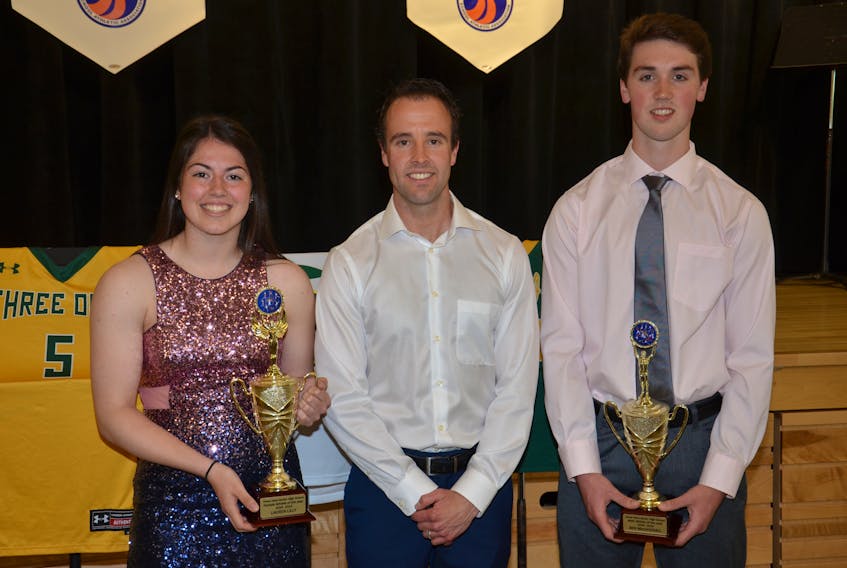 Three Oaks Senior High School athletic director Joel Arsenault, centre, congratulates the 2018-19 athletes of the year, Lauren Lilly and Ben MacDougall. The presentations were made during the school’s recent athletic awards dinner.